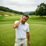 Golfer Thinking and Scratching His Head